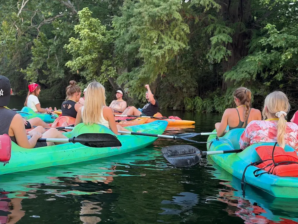 Kayaks and paddleboards lined up at Live Love Paddle