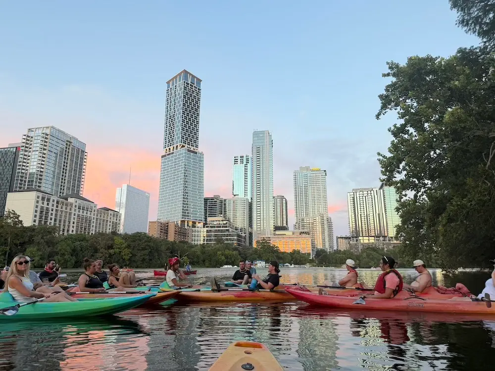 Urban Austin Kayak Tour paddling past the city skyline on Lady Bird Lake